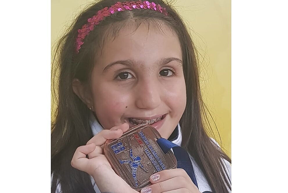 Manuela segura medalha