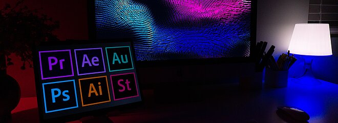 Imagem com um computador com aplicativos da empresa Adobe
