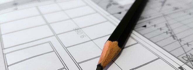 Projeto de arquitetura com lápis em cima 